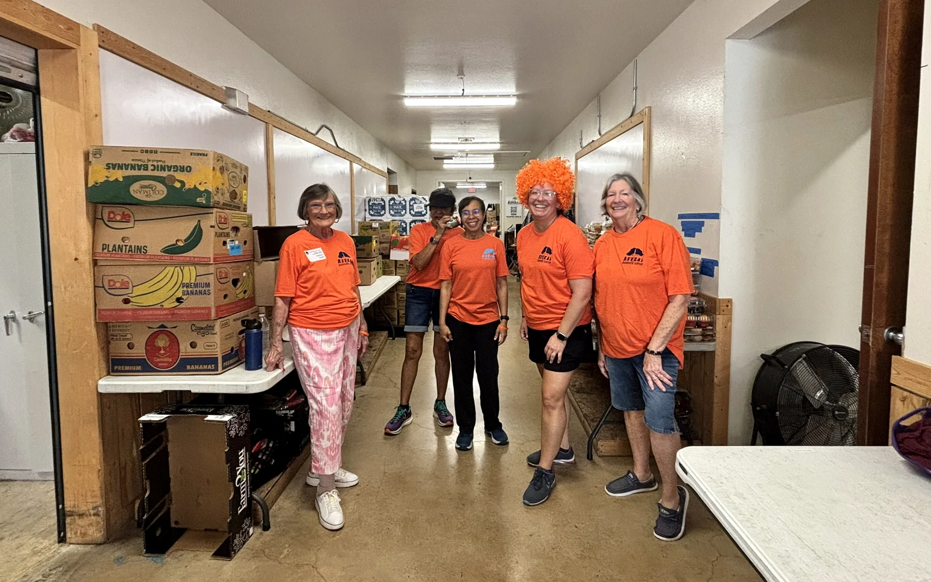 Reveal volunteers gathered in the pantry before food distribution.